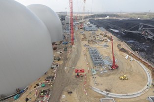 Specially designed domes are being erected to store biomass at the site